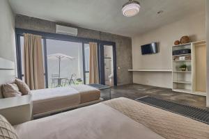 Postel nebo postele na pokoji v ubytování Aura Hotel B&B