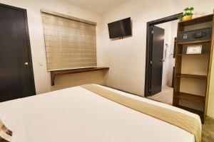 Postel nebo postele na pokoji v ubytování Aura Hotel B&B