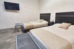 Postel nebo postele na pokoji v ubytování Aura Hotel B&B