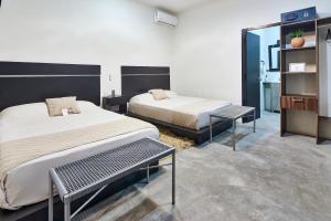 Postel nebo postele na pokoji v ubytování Aura Hotel B&B