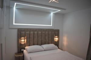 a bedroom with a bed with two white pillows at Moco - Novalja in Novalja