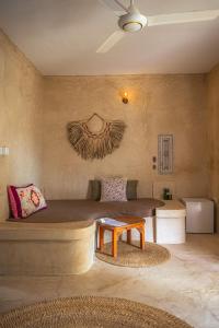 a living room with a couch and a table at The Garden in Paje