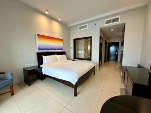 Uma cama ou camas num quarto em Radisson Blu Resort, Fujairah