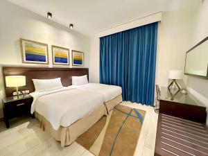 Uma cama ou camas num quarto em Radisson Blu Resort, Fujairah