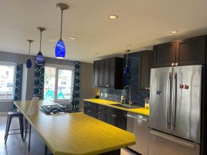 a kitchen with a stainless steel refrigerator and a counter at Little holiday home in Yellowknife