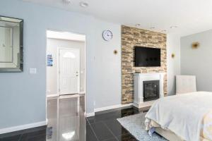 a bedroom with a bed and a fireplace at Chic Victorian Oasis - Oakland Heart in Oakland