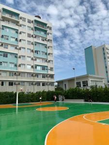 a basketball court in front of a large building at Mountain Views Studio Two Dumaguete in Dumaguete +16 photos
