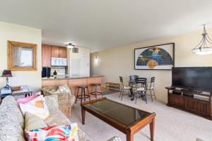 a living room with a couch and a table at Sugar Beach Resort, #130 condo in Kihei