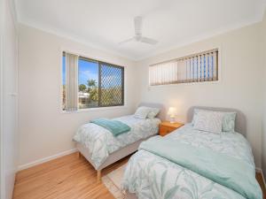 Postel nebo postele na pokoji v ubytování 9 Rowell Street Battery Hill QLD