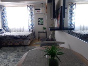 Postel nebo postele na pokoji v ubytování Avida Tower 1