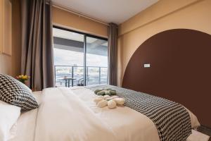 Posteľ alebo postele v izbe v ubytovaní Livetour Hotel Gulao Water Town OCT Jiangmen
