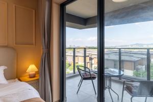 Posteľ alebo postele v izbe v ubytovaní Livetour Hotel Gulao Water Town OCT Jiangmen