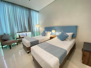 Voodi või voodid majutusasutuse UPad Hotel toas