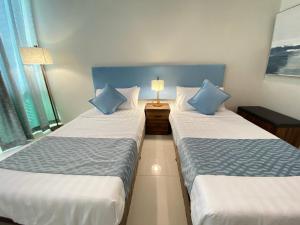 Voodi või voodid majutusasutuse UPad Hotel toas