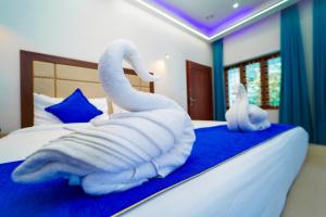 Postel nebo postele na pokoji v ubytování Skylar Seaview Beach Resort & Ayurveda Varkala