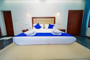 Postel nebo postele na pokoji v ubytování Skylar Seaview Beach Resort & Ayurveda Varkala