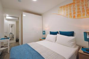 
Ein Bett oder Betten in einem Zimmer der Unterkunft Residenza Corso Saba
