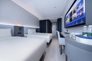 Postel nebo postele na pokoji v ubytování Atour Light Hotel Hefei West Wangjiang Road