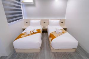Postel nebo postele na pokoji v ubytování A Traveller's Inn