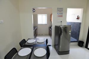 Voodi või voodid majutusasutuse Divya Comforts- 2BHK toas
