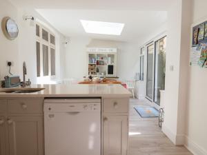 a kitchen with a sink and a dishwasher at 5 Belmont Terrace in Beer