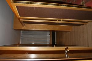 a wooden shelf with a window in a room at Appartamento Amba 39 in Mezzana