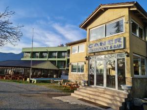 a gambler restaurant and bar with a building at Caner Mountain Hotel in Antalya