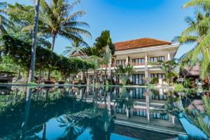 a view of the resort from the pool at Mina Tanjung Hotel in Tanjung