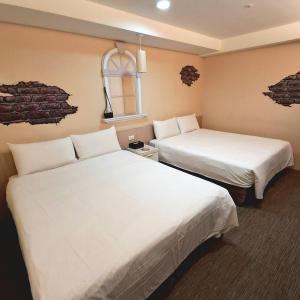 Ένα ή περισσότερα κρεβάτια σε δωμάτιο στο Morwing Hotel Fuzhong