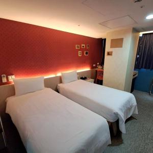 Ένα ή περισσότερα κρεβάτια σε δωμάτιο στο Morwing Hotel Fuzhong