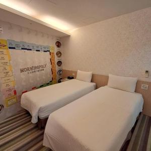 Ένα ή περισσότερα κρεβάτια σε δωμάτιο στο Morwing Hotel Fuzhong
