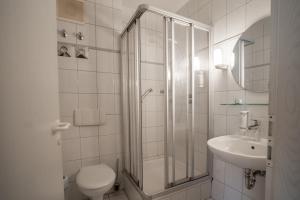 Koupelna v ubytování Appart-Haus Business Apartments + 20 fotografií