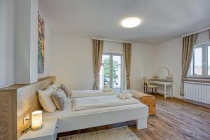a living room with a couch and a table at Ivana in Karpijan in Umag +37 photos