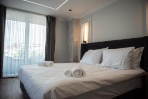 Postel nebo postele na pokoji v ubytování Hotel Luciano