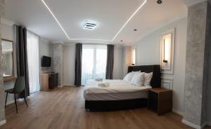 Postel nebo postele na pokoji v ubytování Hotel Luciano