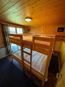 an overhead view of a bedroom with two bunk beds at Chalet Glücksfall in Bellwald