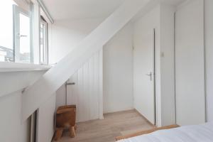 Una cama o camas en una habitación de Zilt & Zand