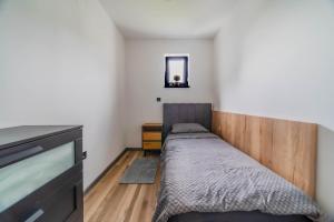 a small bedroom with a bed and a mirror at Wellness Villa Joy near Varaždin - Happy Rentals in Sračinec +40 photos