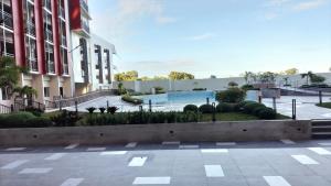 a rendering of the courtyard of a building with a swimming pool at comfy Primeworld district in Lapu Lapu City