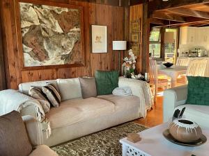 a living room with a couch and a table at House 37 Nkululeko in Sodwana Bay Lodge in Sodwana Bay