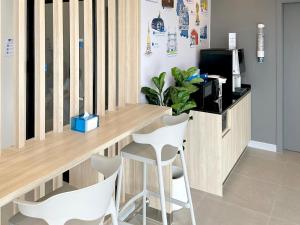 Телевизор и/или развлекательный центр в HOP INN Nakhon Phanom