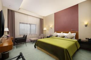Ένα ή περισσότερα κρεβάτια σε δωμάτιο στο Grand Noble Hotel Xi’an +37 φωτογραφίες