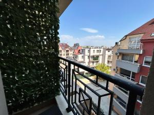 a balcony with a green ivy wall at Old Town Apartment 3 with Free Private Parking in Plovdiv