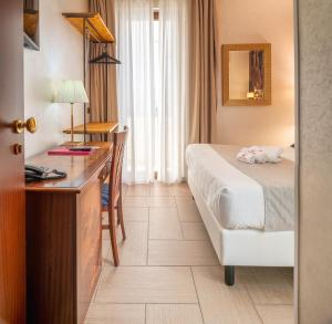Voodi või voodid majutusasutuse Hotel Flora toas