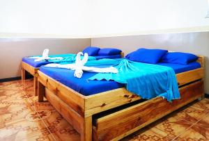 Postel nebo postele na pokoji v ubytování RedDoorz at Bilza Lodge Sagada