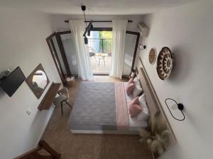 an overhead view of a bedroom with a bed and a mirror at Pantheon in Skiathos Town +32 photos