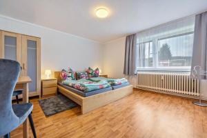 a living room with a couch and a window at Schöner Ith Blick in Salzhemmendorf