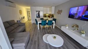 a living room with a couch and a table at Appartement Ponte de lima in Ponte de Lima