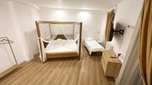 Postel nebo postele na pokoji v ubytování Domino Hotel