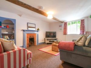 TV a/nebo společenská místnost v ubytování Brook Cottage